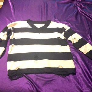 Distressed black and white sweater